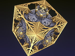 gold-colored 3-d cube with mechanical parts