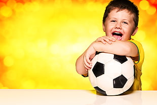 boy holding soccer ball HD wallpaper