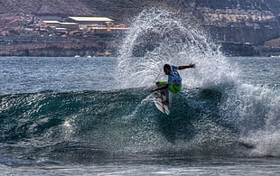 man in blue shirt and green shorts surfing at blue sea during daytime, islas canarias, gran canaria, la playa HD wallpaper