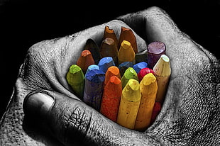 person holding crayons