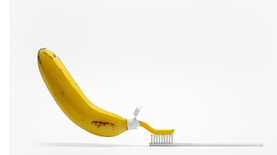 banana-themed toothpaste tube bottle and white toothbrush, humor, minimalism, bananas, toothbrush