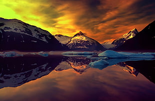 landscape photography of white snow covered mountain peak with reflection on water