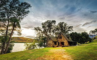 beige stone house, cottage, river, HDR