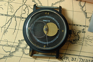 round black Paketa chronograph watch, watch, map