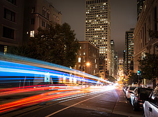 time-lapse photography of building, light trails, city, night, long exposure