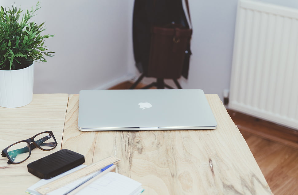 MacBook Pro;and black framed eyeglasses HD wallpaper