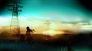 silhouette of woman near transmission line