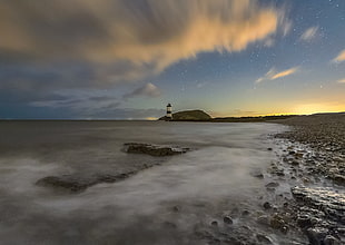 timelapse photo of sea and lighthouse during daytime, penmon, anglesey HD wallpaper