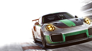 photography of silver, green, and black Porsche 911 on race track