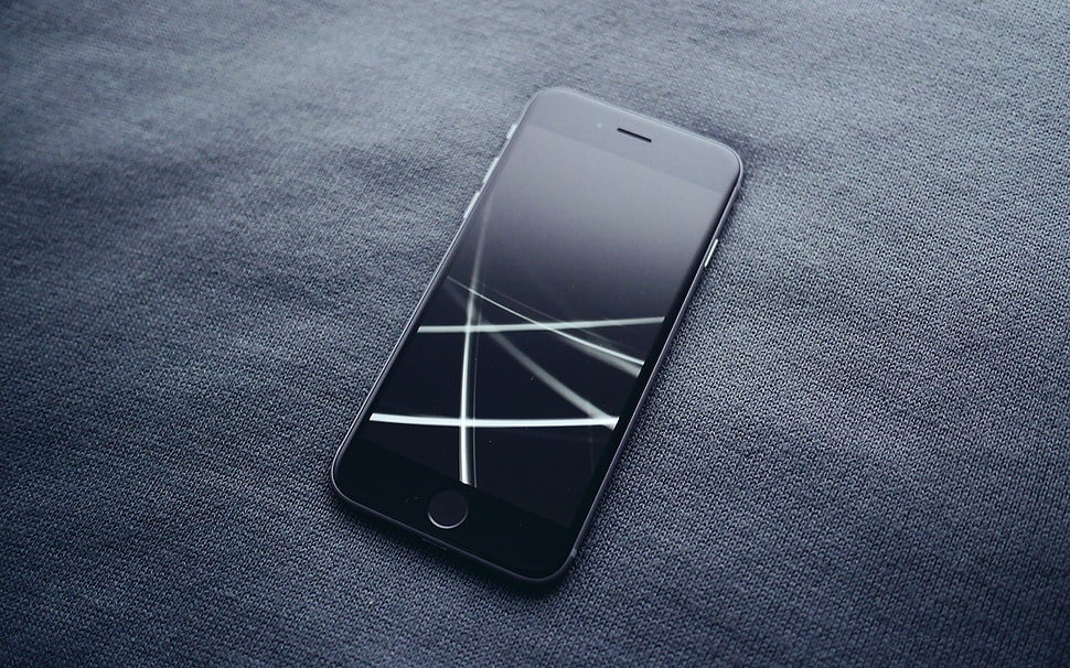 space gray iPhone 6 on textile HD wallpaper