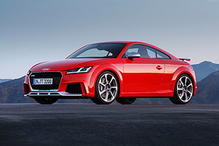 shallow focus photography of red Audi coupe