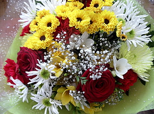 bouquet of white , yellow , and red flowers