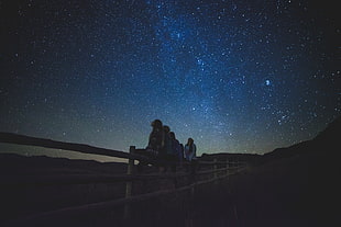 people watching stars during nighttime