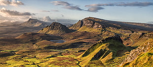 landscape photo of rocky mountains under cloudy sky, quiraing, skye, scotland