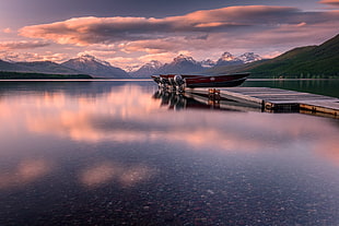 assorted outboard boats parked on wooden pier during dunset, lake mcdonald HD wallpaper