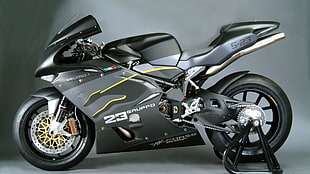 gray Voltro 1 sport bike with paddock stand HD wallpaper