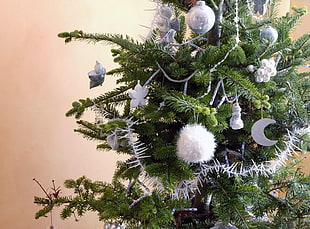 green christmas tree with white decors