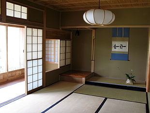 white lantern hanging inside of room