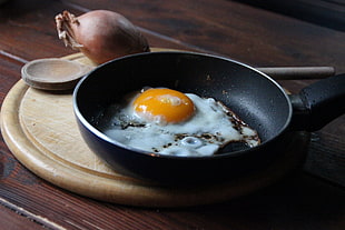 fried egg on black frying pan