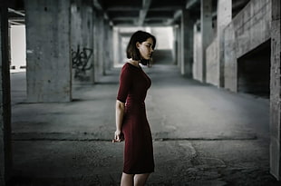 woman in red quarter-sleeved dress