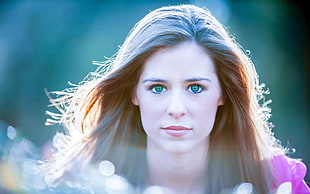 closeup photography of woman with green eyes during daytime