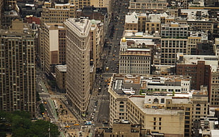 aerial photography of triangular-shaped gray high-rise building