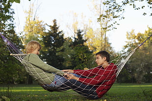 man and woman on hammock
