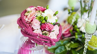 photo of bouquet of pink and white flower with glass vase