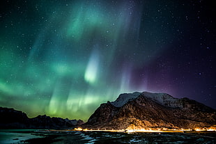 sky phenomenon over mountain and body of water, aurorae, stars, night, mountains