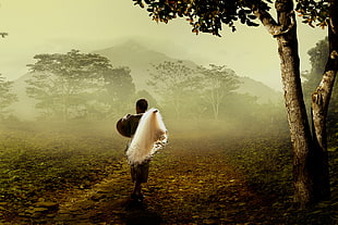 man walking on the forest holding fish net painting HD wallpaper
