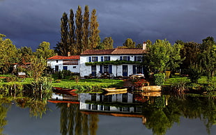 beige clinker boat, cabin, building, house, reflection