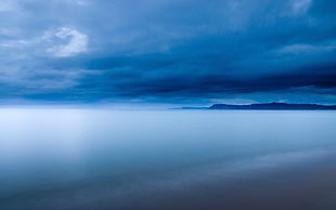 landscape photography of body of water under cloudy sky HD wallpaper
