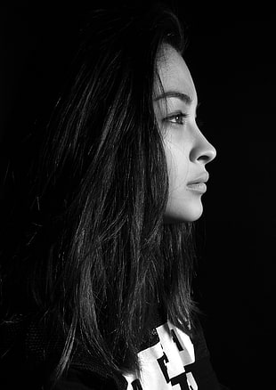 greyscale photography of a woman facing left side