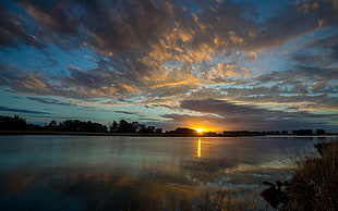 calm lake during sunset panoramic photography HD wallpaper