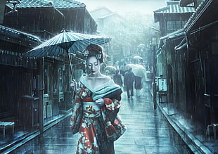 selective color photography of woman in traditional dress holding umbrella