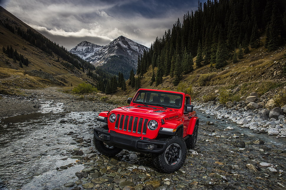 red and black Jeep Wrangler near mountain during daytime HD wallpaper