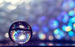 clear plastic ball ornament, marble, translucent, reflection, colorful