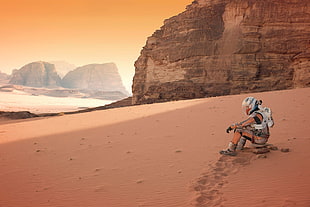 person with helmet sitting on rack surrounded by sand near mountain, movies, The Martian, Mars