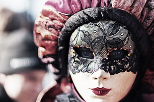 closedup photo of woman wearing masquerade