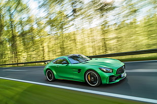 time lapse photography of green coupe