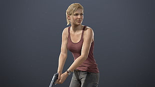 woman wearing brown sleeveless blouse holding pistol