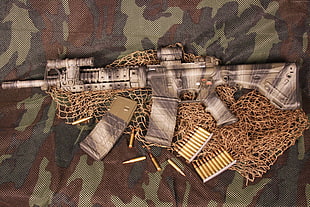 gray and brown submachine gun rifle