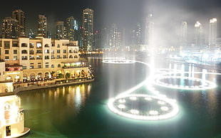 beige painted building beside body of water with dancing water, city, cityscape, United Arab Emirates, Dubai