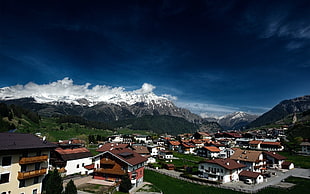 town near a rocky mountain HD wallpaper