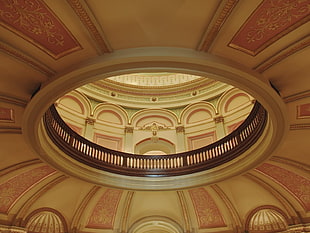 low angle photo of dome building ceiling with balustrade