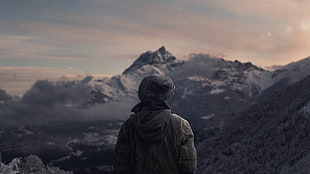 man with white jacket staring on black and white mountain HD wallpaper