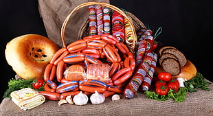 meat sausages inside a wicker basket