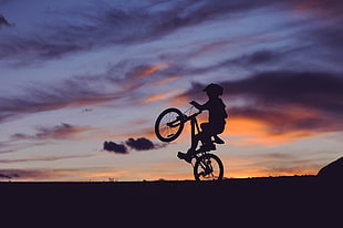 silhouette of man riding bicycle HD wallpaper