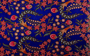blue, pink, and orange flower print textile