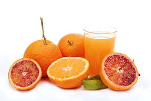 orange fruit juice with pint glass